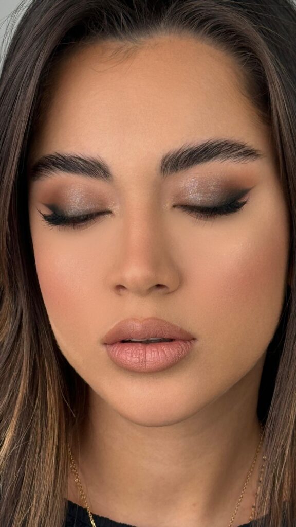 Makeup products in warm and golden shades suitable for Indian skin tones, including foundation, lipstick, and blush.